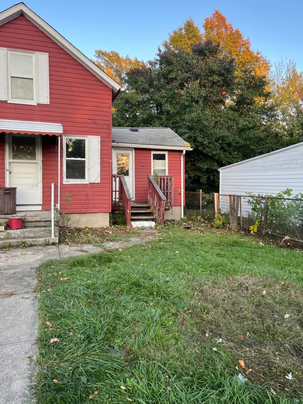 Cleveland home showing cleaned foundation area after bush and small tree removal